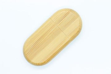 Wooden flash drive located on a white background