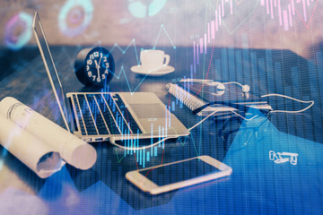 Financial chart drawing and table with computer on background. Multi exposure. Concept of international markets.