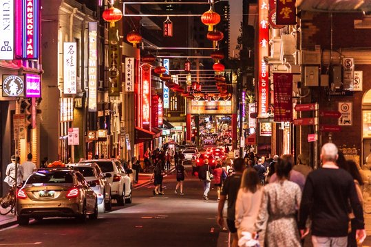 Melbourne, Victoria, Australia, March 7th 2019: The many signs, lights and lanterns in the chinatown area in the centre of Melbourne in the early evening.