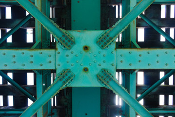 Low angle shot of Hendrix green railway bridge texture on a sunny day in Zagreb