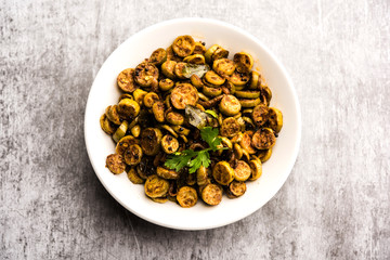 Tendli / Kundroo sabzi or Kovakkai Poriyal also known as ivy gourd, served in a bowl or karahi. selective focus