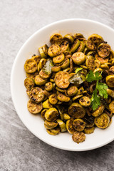 Tendli / Kundroo sabzi or Kovakkai Poriyal also known as ivy gourd, served in a bowl or karahi. selective focus