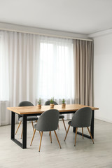 Modern room interior with chairs and table