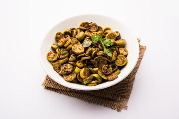 Tendli / Kundroo sabzi or Kovakkai Poriyal also known as ivy gourd, served in a bowl or karahi. selective focus