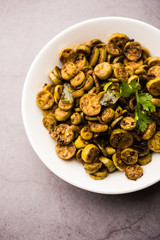 Tendli / Kundroo sabzi or Kovakkai Poriyal also known as ivy gourd, served in a bowl or karahi. selective focus
