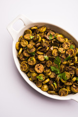 Tendli / Kundroo sabzi or Kovakkai Poriyal also known as ivy gourd, served in a bowl or karahi. selective focus