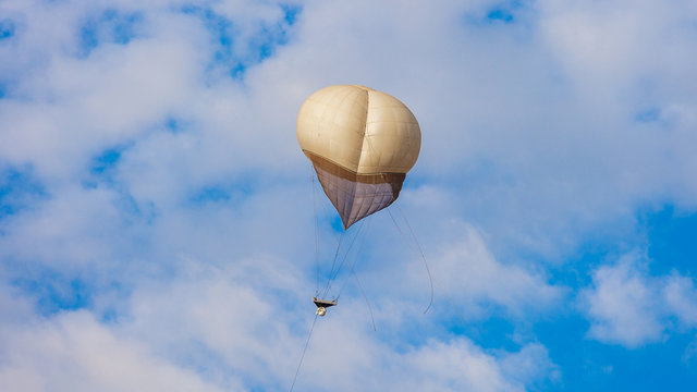 White Military Balloon In A White Clouds