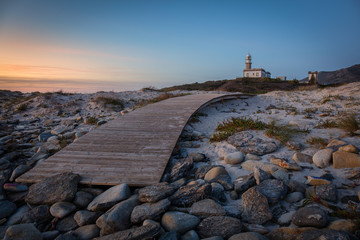Fototapeta na wymiar Lariño lighthouse at sunset. Carnota, Galicia, Spain.