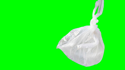 White plastic bag with a green background
