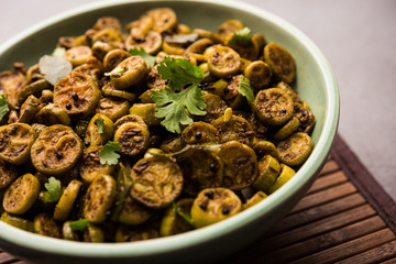 Tendli / Kundroo sabzi or Kovakkai Poriyal also known as ivy gourd, served in a bowl or karahi. selective focus