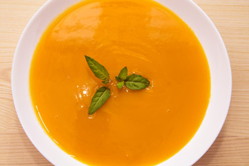 vegetable and carrot soup on background