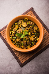 Tendli / Kundroo sabzi or Kovakkai Poriyal also known as ivy gourd, served in a bowl or karahi. selective focus