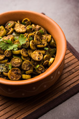 Tendli / Kundroo sabzi or Kovakkai Poriyal also known as ivy gourd, served in a bowl or karahi. selective focus