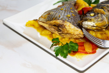 Roasted fish with potatoes for dinner or lunch at Christmas or New Year