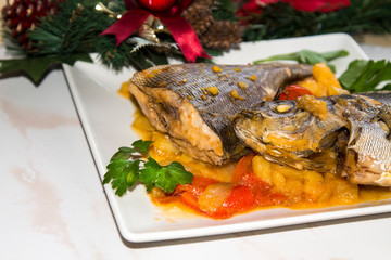 Roasted fish with potatoes for dinner or lunch at Christmas or New Year
