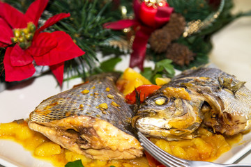 Roasted fish with potatoes for dinner or lunch at Christmas or New Year