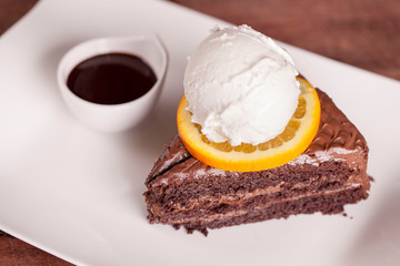 Soft chocolate cake and a scoop of vanilla ice cream