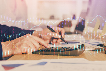 Financial trading graph multi exposure with man desktop background.