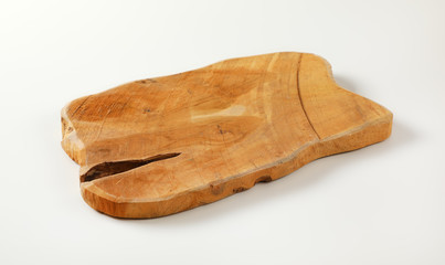 Wooden cutting board with natural edge