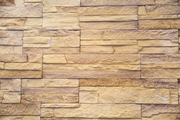 Background tiles facing irregular rectangular shape light sand color. Design backgrounds texture construction.