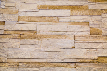 Background tiles facing irregular rectangular shape light beige. Design backgrounds texture construction.