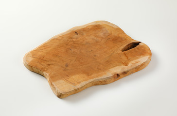 Wooden cutting board with natural edge