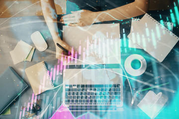 Financial graph displayed on woman's hand taking notes background. Concept of research. Multi exposure