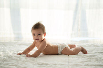 baby on the bed.