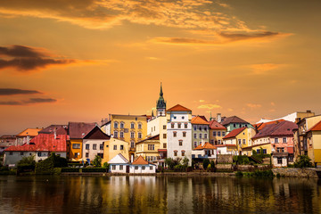 Fototapeta na wymiar Jindrichuv Hradec panoramic cityscape with Vajgar pond in the foreground on a sunset. Czech Republic.