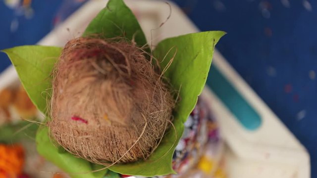Traditional indian wedding ceremony:  coconut in decorative coper kalash 