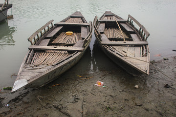 Fototapeta na wymiar Boat floating over Brahmaputra river in Mymensingh 