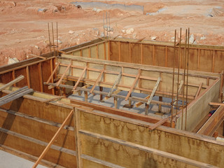 Building ground beam under construction using temporary timber plywood at the site. Reinforced by...