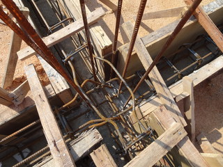 Building ground beam under construction using temporary timber plywood at the site. Reinforced by the reinforcement steel to strengthen the structure.   