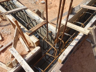Building ground beam under construction using temporary timber plywood at the site. Reinforced by the reinforcement steel to strengthen the structure.   