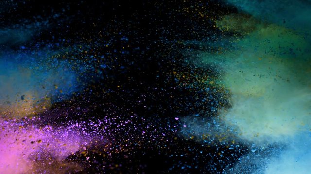 Super slow motion of coloured powder collision isolated on black background. Filmed on high speed cinema camera, 1000fps.