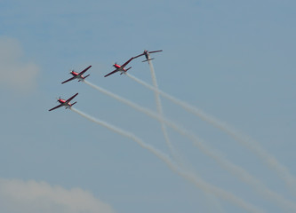 Turboprop light-engine aircrafts flying in the air.