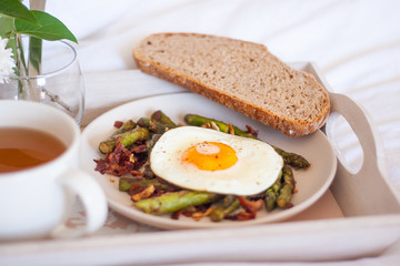 Breakfast in bed - roasted asparagus and sunny side egg