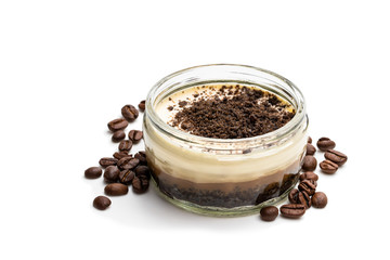 Layered creamy cappuccino cheesecakes in glass jar isolated on white