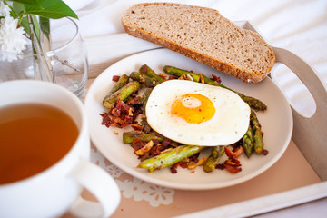 Breakfast in bed - roasted asparagus and sunny side egg