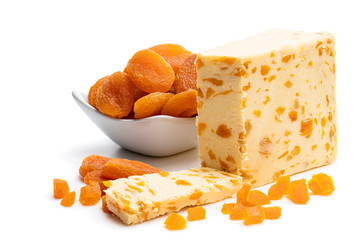 Traditional cheddar cheese with dry apricot isolated on white