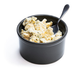 Potted aged Blue stilton cheese isolated on white