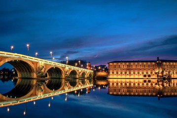 Fototapeta na wymiar A panoramic view of the Pont Neuf bridge spanning the Garonne River in the heart of Toulouse, France