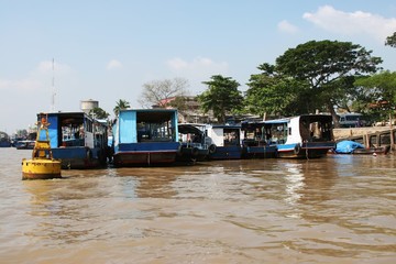Rows of boats berthed at the Mekong riverbank in the Mekong Delta, Vietnam