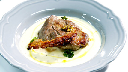 Hot steak on white with bacon