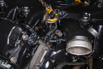 Fototapeta na wymiar Disassembled motor for a car.