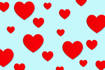 Red decorative hearts on a blue background.