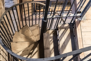 The spiral staircase with the wooden stairs, spiral stairs top view - Image