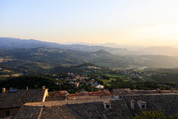 Old town of San Marino with the hilly landscape in the background
