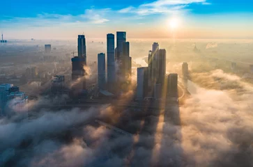 Foto op Plexiglas A aerial view of towers of the Moscow International Business Centre also known as Moscow City at dawn. © Dmitry