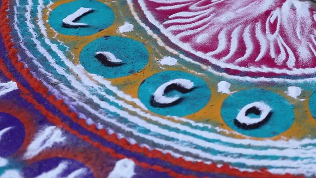 Maharashtrian Wedding - Decorative Flower Rangoli and oil lamp to welcome relatives 